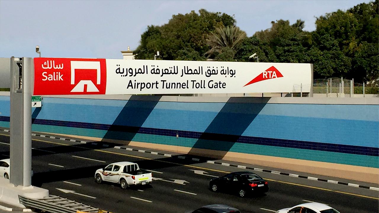 RTA airport tunnel toll gate board sign board informing about salik gateway.