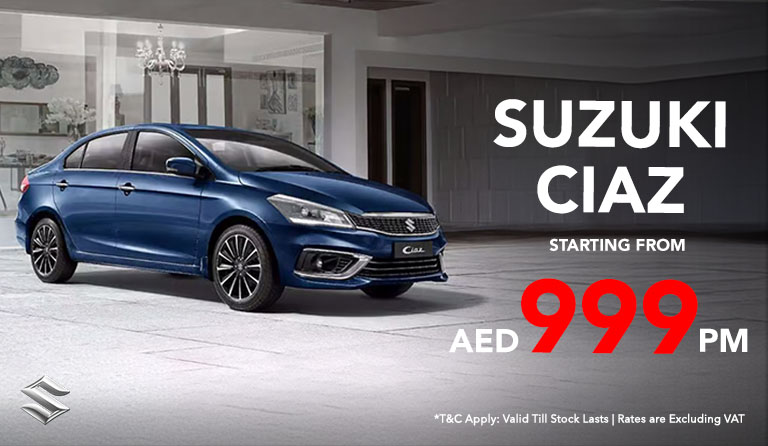 Stylish Suzuki ciaz blue color parked, also showcasting starting price from AED 999/month