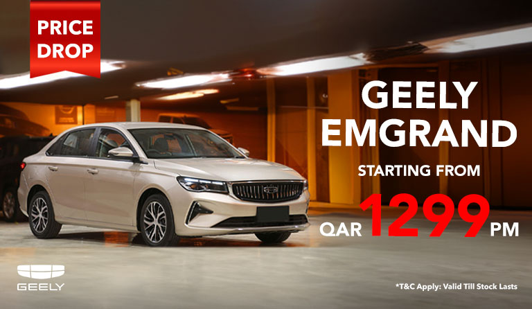 White color Geely emgrand car parked in basement and highlighting price drop - starting price is from QAE 1299/month.