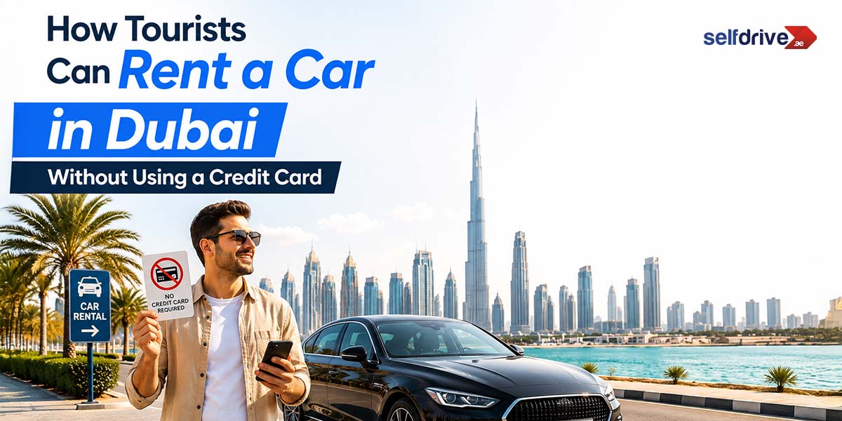 A man smiles while holding keys beside a black car near Dubai Marina. The skyline, including the Burj Khalifa, is visible. Text: "How Tourists Can Rent a Car in Dubai Without Using a Credit Card."